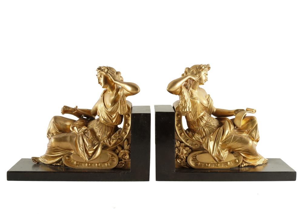 Appraisal: PAIR OF NEOCLASSICAL GILT METAL BOOKENDSunsigned each on an ebonized