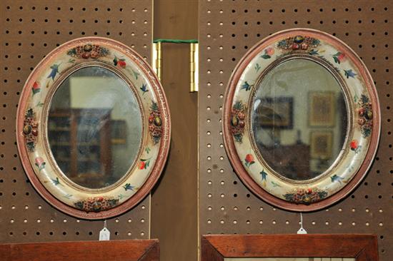 Appraisal: PAIR OF OVAL MIRRORS Floral decorated mirrors handpainted in shades