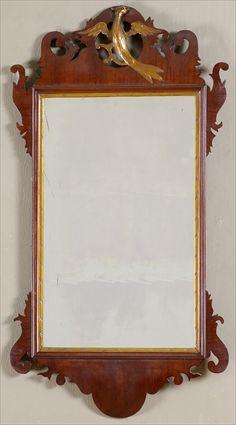 Appraisal: CHIPPENDALE MAHOGANY AND PARCEL-GILT MIRROR The plate within giltwood band