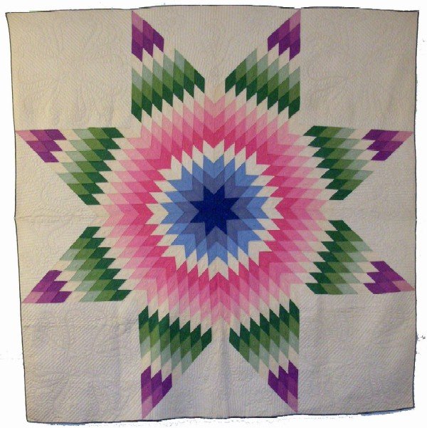 Appraisal: Star quilt of multiple colors Quilted green piping to sides