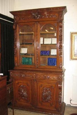 Appraisal: A VICTORIAN CARVED OAK TWO STAGE BOOKCASE moulded cornice over