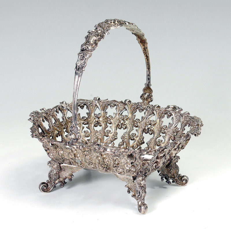 Appraisal: AUSTRO-HUNGARIAN PIERCED SILVER BASKET VIENNA Delicately embossed floral motif basket