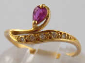 Appraisal: A French hallmarked carat gold ruby and diamond ring size