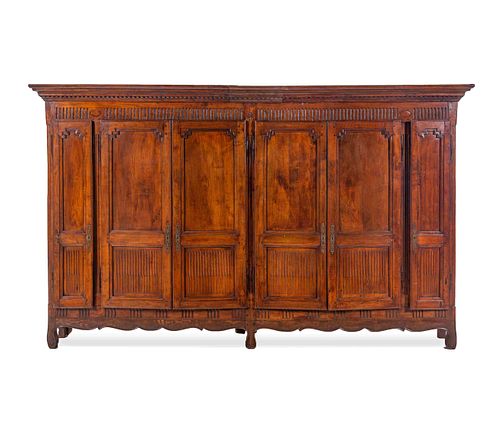 Appraisal: A FRENCH PROVINCIAL WALNUT BIBLIOTHEQUEA French Provincial Walnut Bibliotheque th