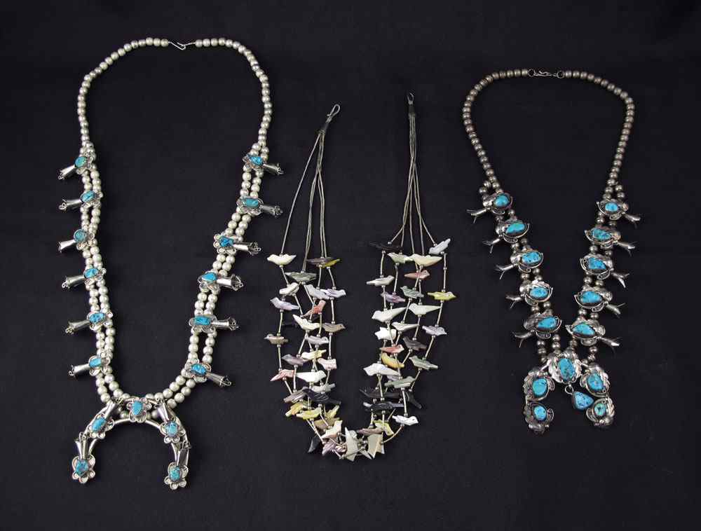 Appraisal: THREE NATIVE AMERICAN INDIAN SILVER NECKLACES Sterling squash blossom necklace