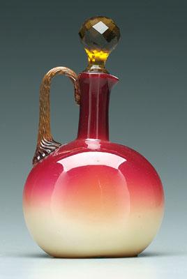 Appraisal: Wheeling peachblow decanter glossy finish twisted and reeded amber handle