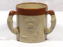 Appraisal: A large three handled ceramic loving cup the handles formed