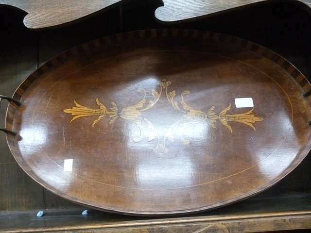 Appraisal: A VICTORIAN WALNUT SHAPED TRAY with inset bead work panel