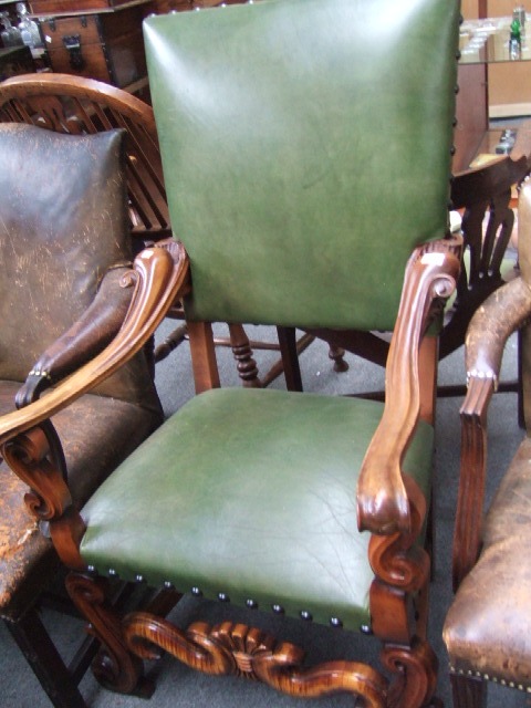 Appraisal: A th century walnut framed open armchair with padded rectangular