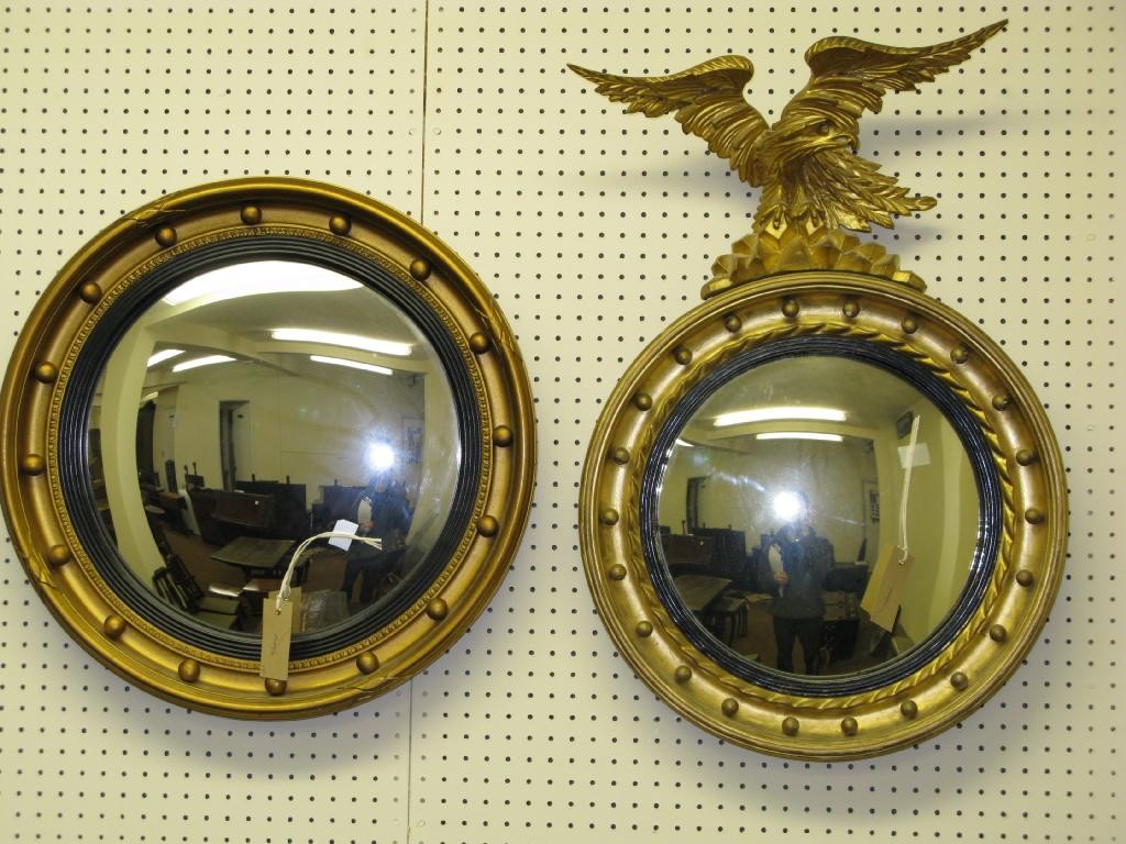 Appraisal: A th Century gilt convex mirror with carved wood eagle