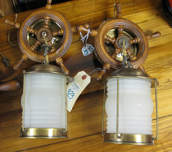 Appraisal: THREE WAGON WHEEL DESIGN FIXTURES The center fixture has -lights