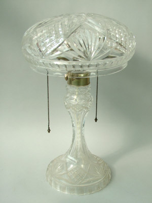 Appraisal: A cut glass twin light table lamp on circular base