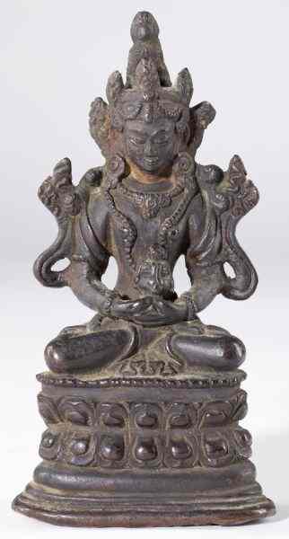 Appraisal: Bronze Buddhaseated on a lotus throne with opening below for