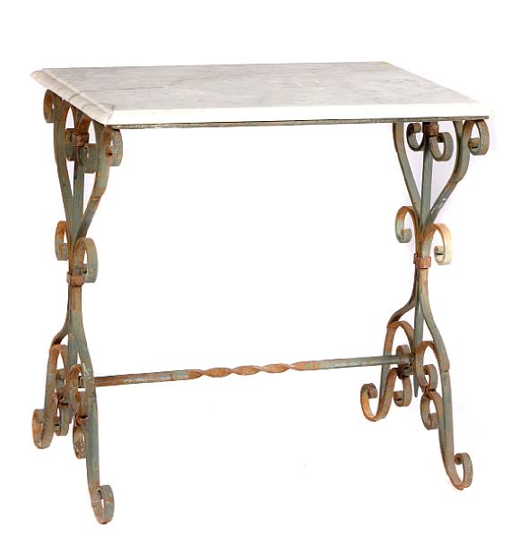 Appraisal: A pair of wrought iron marble topped tables height in