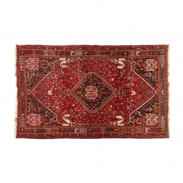 Appraisal: PERSIAN TRIBAL AREA RUG Red field with central brown medallion