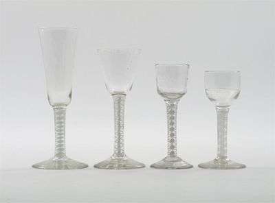 Appraisal: Four glasses with tapered bucket-shaped and wrythen bowls on double-series