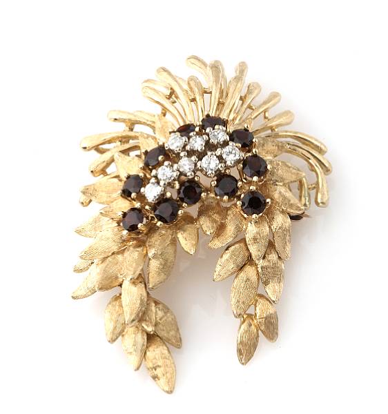 Appraisal: A diamond garnet and k gold brooch with two articulated