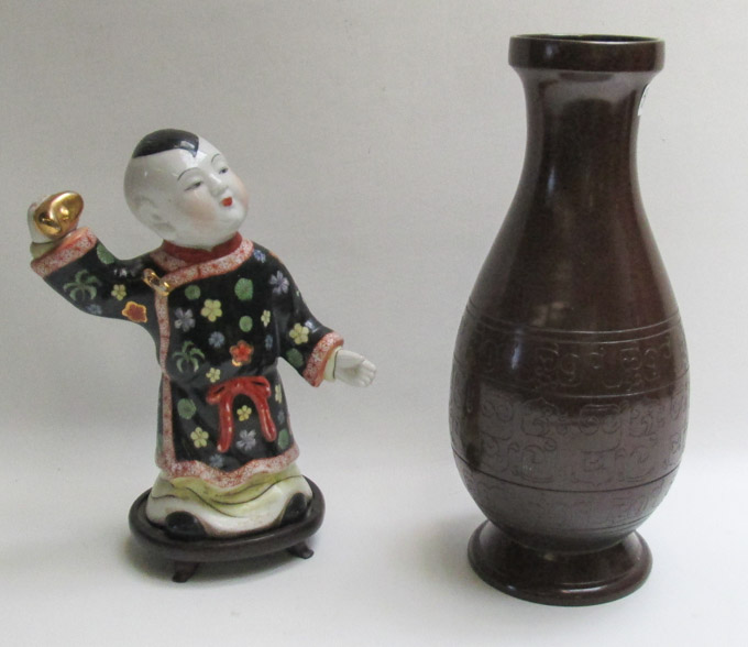 Appraisal: CHINESE PORCELAIN FIGURAL SCULPTURE AND A POTTERY VASE The hand