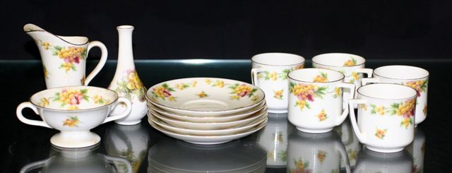 Appraisal: A Royal Doulton part coffee service decorated with wattle decoration