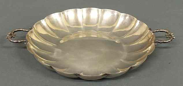 Appraisal: Sterling silver dish with scrolled handles dia troy oz