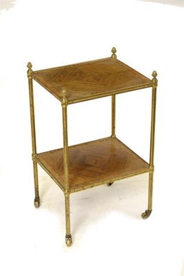 Appraisal: A mahogany and brass two tier etagere the quarter veneered