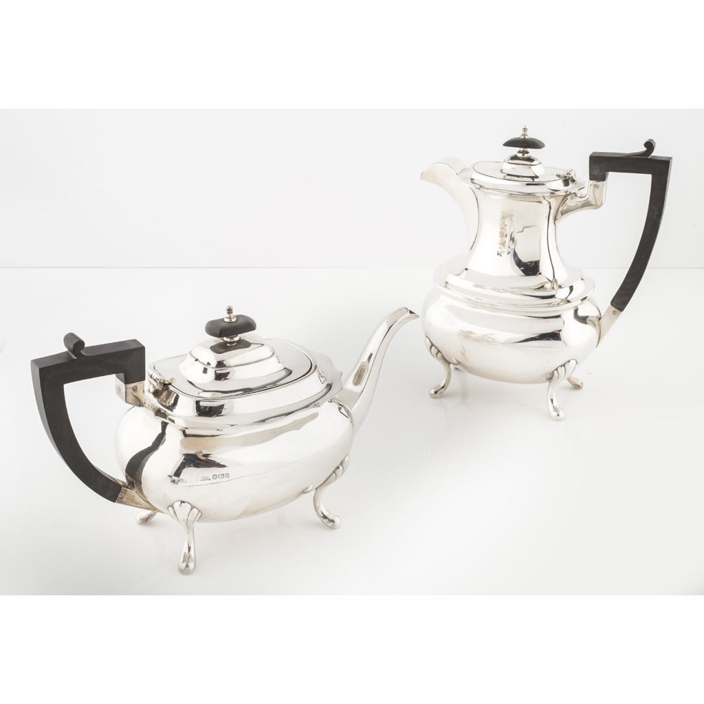 Appraisal: A teapot and matching water pot Walker and Hall Sheffield