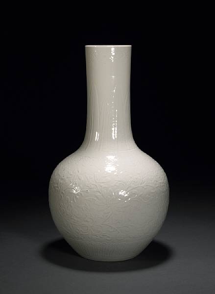 Appraisal: A white glazed soft paste porcelain stick neck vase Late