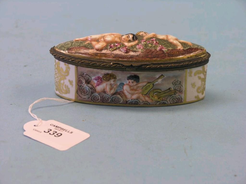 Appraisal: A Naples porcelain trinket box oval-shape relief moulded and painted