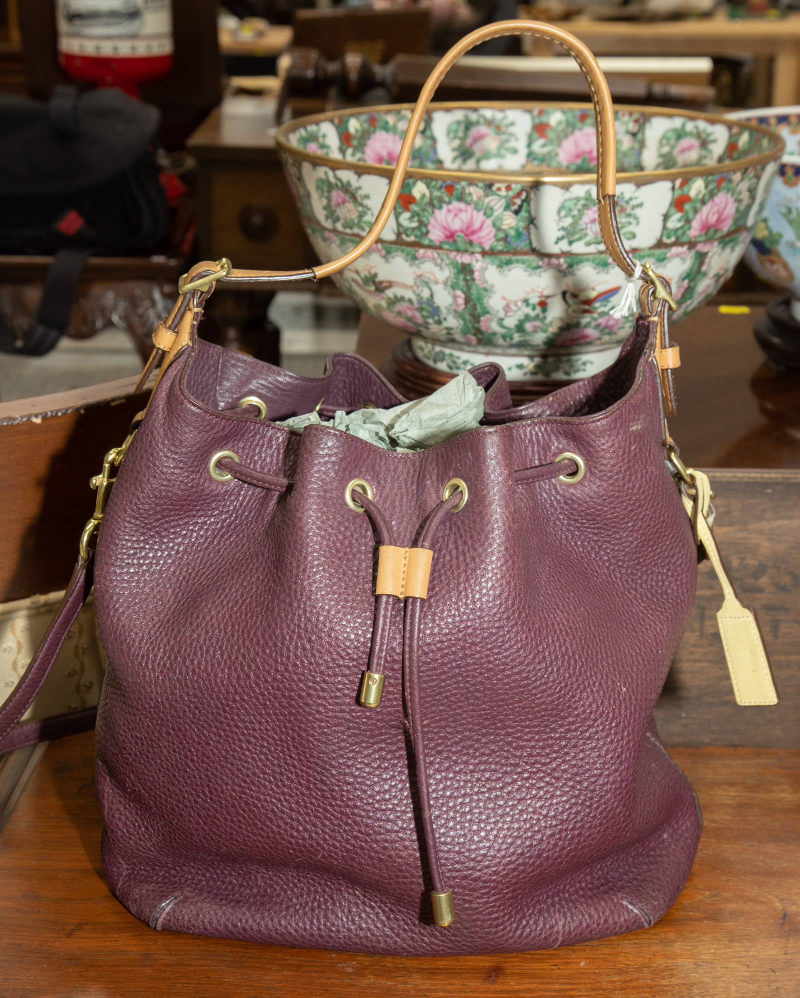 Appraisal: A PURPLE COACH BUCKET BAG A purple beige and yellow