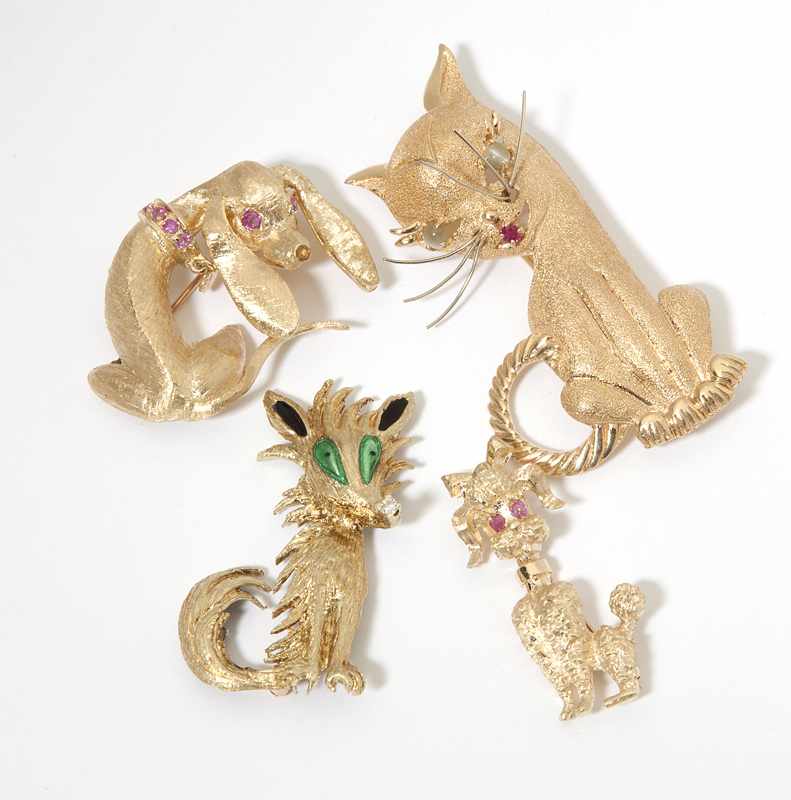 Appraisal: A collection of four gold and gem-set animal brooches Four