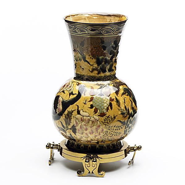 Appraisal: ZSOLNAYUrn on brass base with floral and bird decoration and