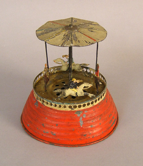 Appraisal: Early tin clockwork musical carousel th c h