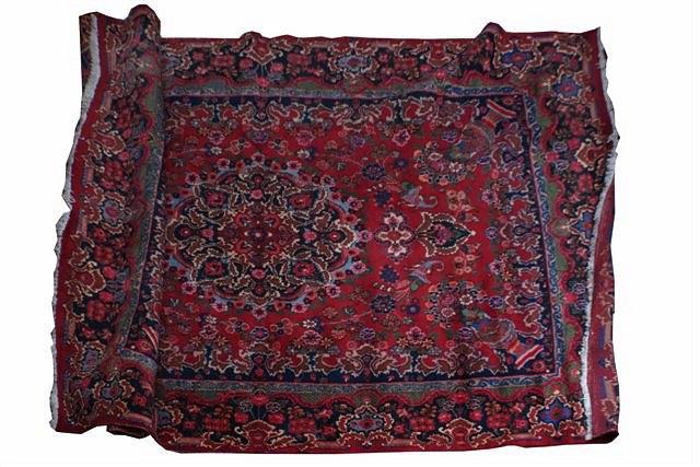 Appraisal: A MESHED CARPET woven with pendant medallion on a rose