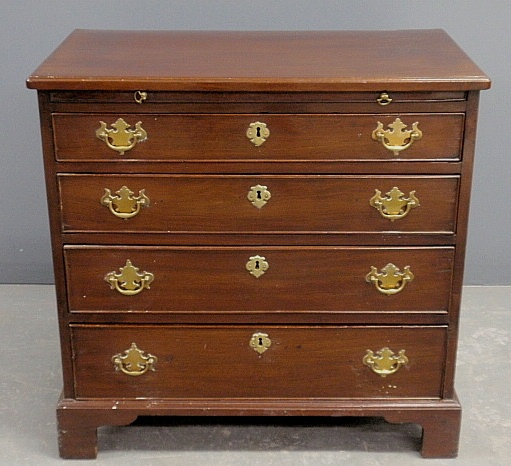 Appraisal: - Diminutive English Chippendale mahogany bachelor s chest with a