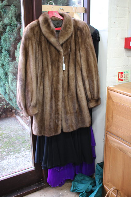 Appraisal: A VINTAGE FUR COAT together with a Parigi sequin cocktail