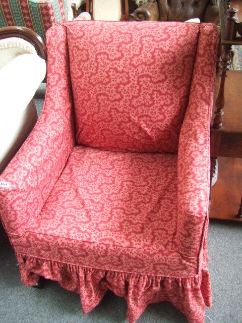 Appraisal: A easy armchair with pink loose cover and moulded square