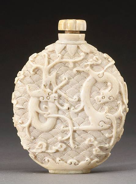 Appraisal: A carved ivory snuff bottle Qing Dynasty Well-hollowed and of