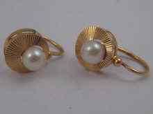 Appraisal: A pair of French hallmarked carat gold pearl earrings approx