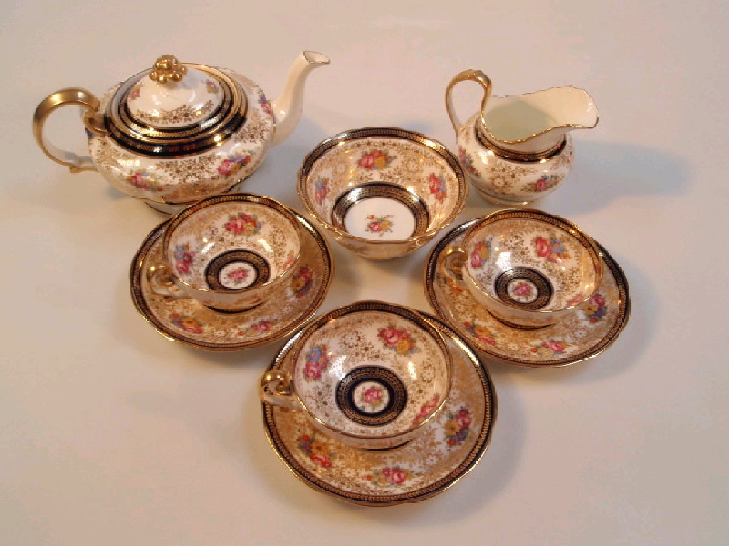 Appraisal: A Cauldon porcelain part tea service decorated with floral sprays