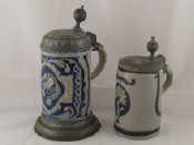 Appraisal: Two th c German stoneware pewter lidded steins the larger