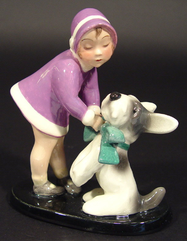 Appraisal: Goldscheider young girl and dog figure group the girl wearing