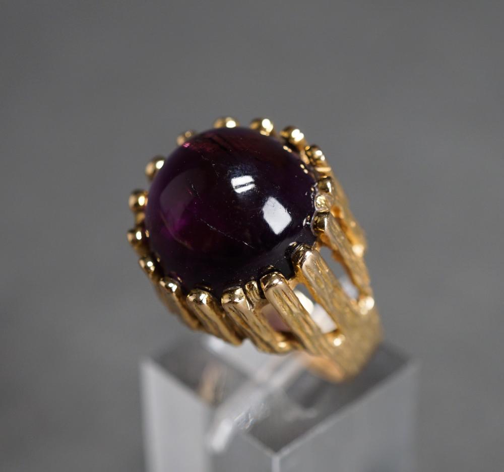 Appraisal: -KARAT YELLOW-GOLD AND AMETHYST CABOCHON RING GROSS DWT SIZE -Karat