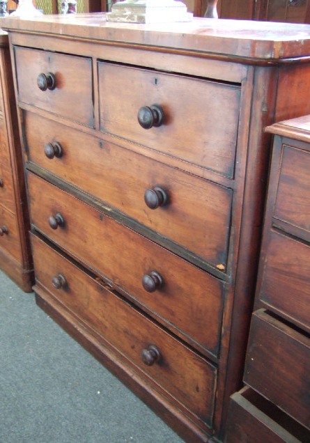 Appraisal: A Victorian mahogany chest of two short and three long