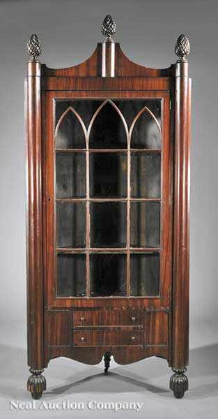 Appraisal: An American Mahogany Corner Cupboard mid- th c pedimented crest