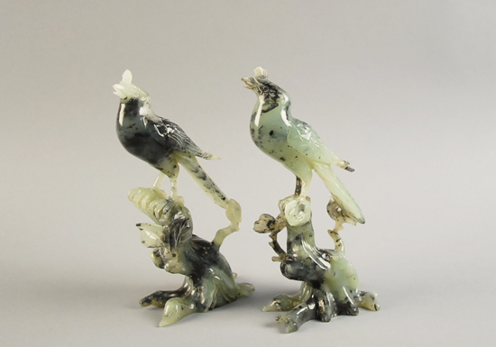 Appraisal: A Pair of Carved Green Stone Birds possibly spinach jade