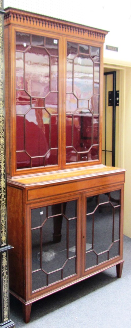 Appraisal: A late th century inlaid satinwood display cabinet the pair