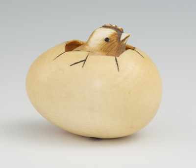 Appraisal: A Carved Ivory Netsuke of a Hatching Chick Carved ivory