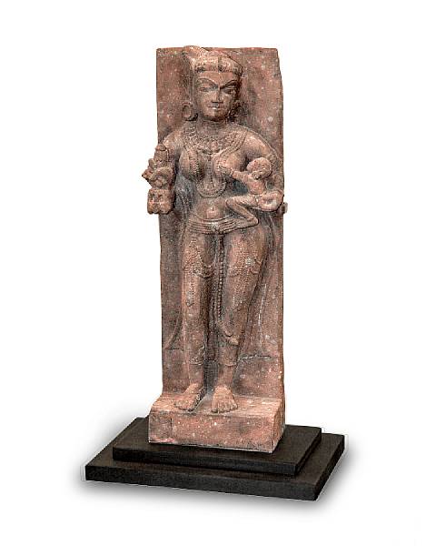 Appraisal: An Indian carved red sandstone fragment of Ambika and child