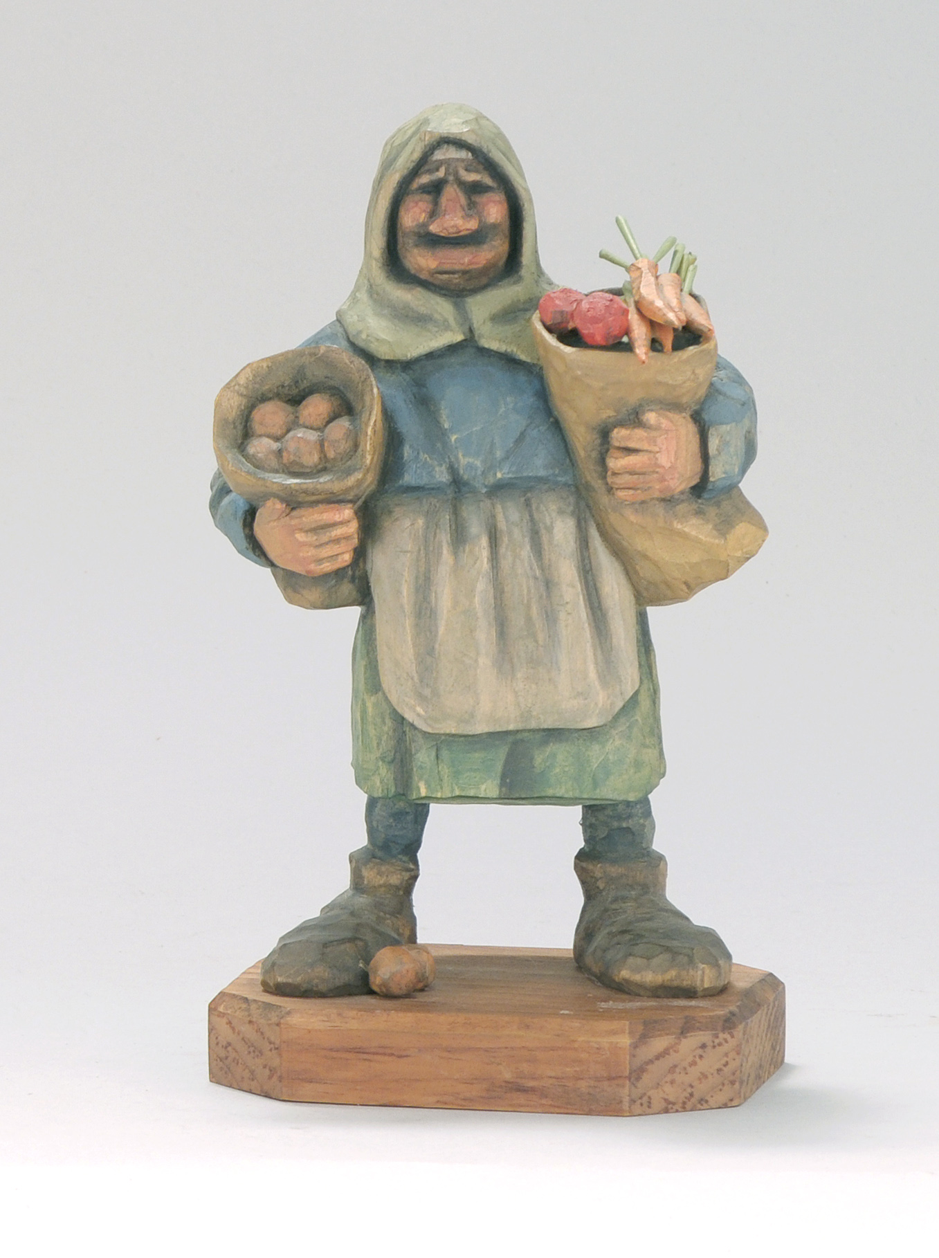 Appraisal: CARVED WOOD FIGURE OF A PEASANT WOMAN By Stan Sparre