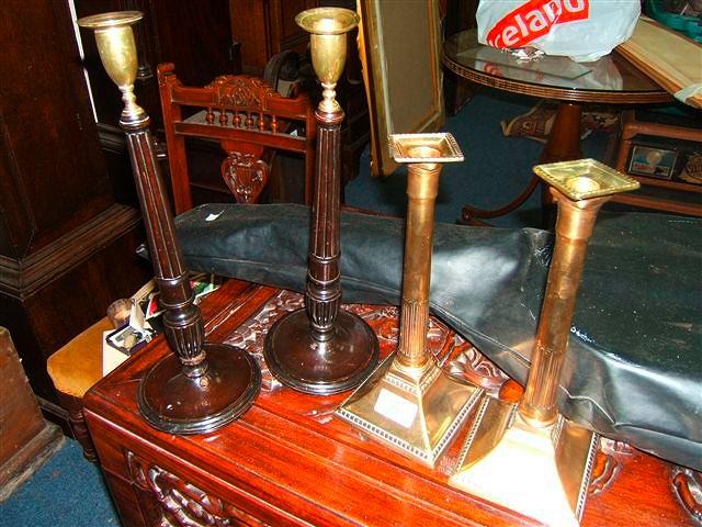 Appraisal: A pair of Chippendale style mahogany and brass candlesticks with